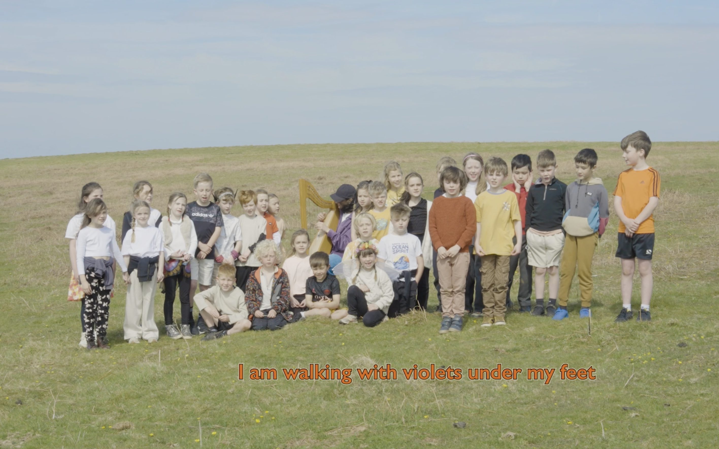 6 kids walking with violets